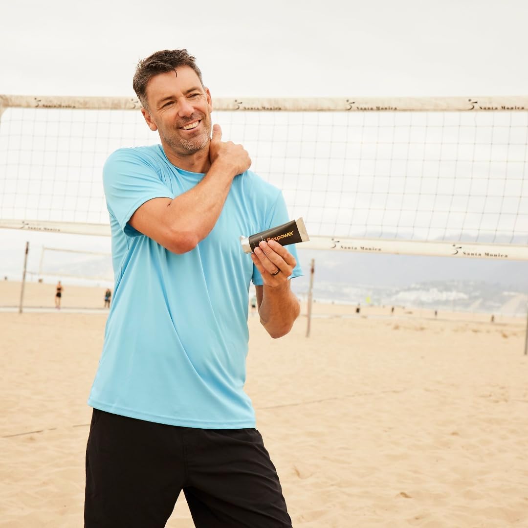A volleyball player massaging Warm into their shoulder before activity